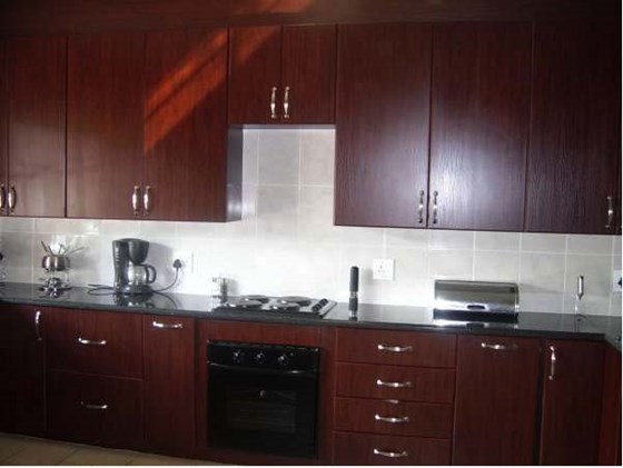 Mahogany Kitchnes: Dark wood kitchens by Blue Granite Kitchen designs