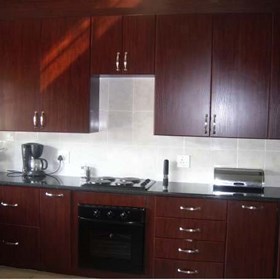 Mahogany Kitchnes: Dark wood kitchens by Blue Granite Kitchen designs
